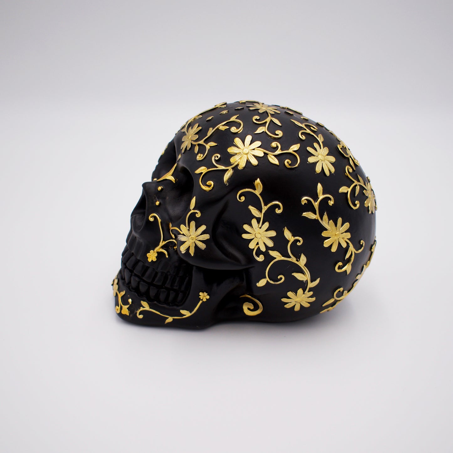 Black Skull with Gold Floral Design Sculpture