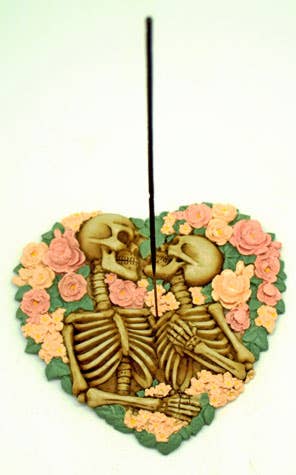 Heart shaped Incense Burner with two skeletons surrounded by flowers.