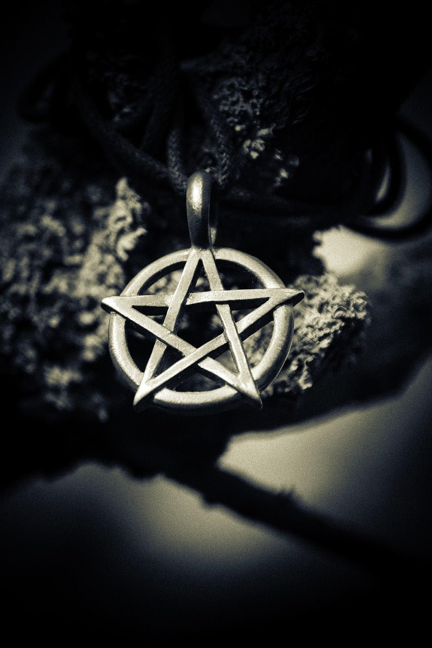 Pentacle Pendant with dark background.