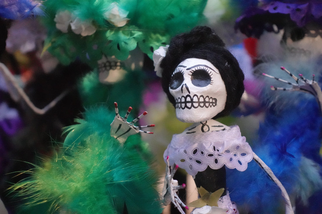 Day of the Dead Statue with colorful background. 