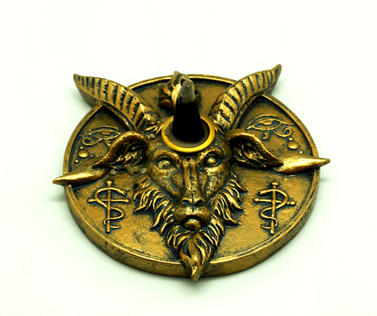 Gold Baphomet goat head with horns incense holder on a white background