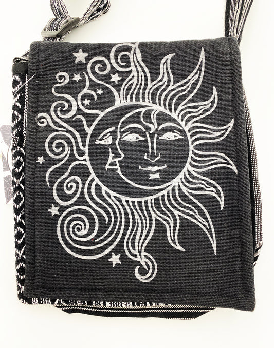 Black bag with white sun and moon design on a white background