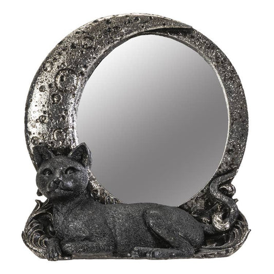 Decorative moon shaped mirror with a cat figurine on a white background