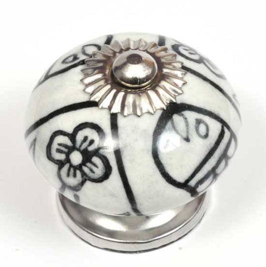 Decorative ceramic knob with floral design on a white background
