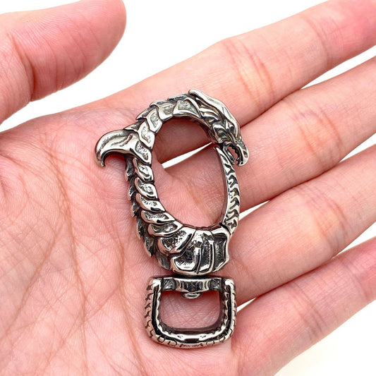 Silver Dragon Head Keychain Pendant in a hand against a white background- Shadowplay Collection Gift Shop