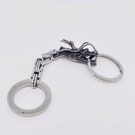 Stainless steel dragon keychain on a white background- Shadowplay Collection Mythical Gifts