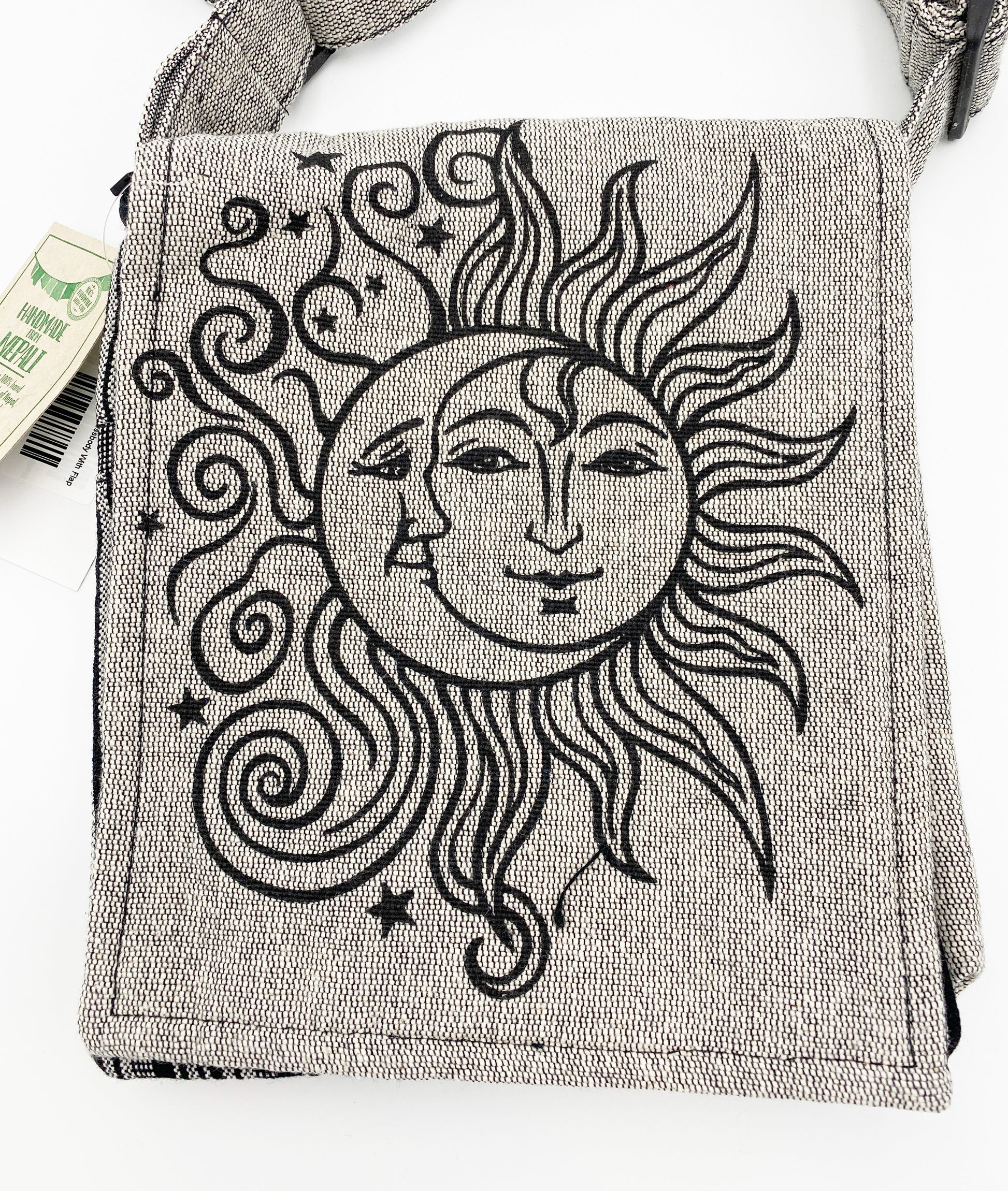 Textile bag with sun and moon design on a white background