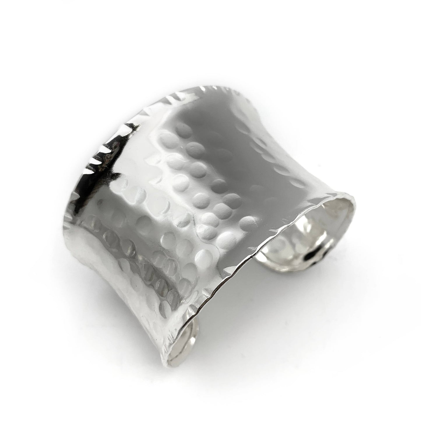Silver plated cuff bracelet with textured surface on a white background- Shadowplay Collection Gift Shop in San Antonio, TX