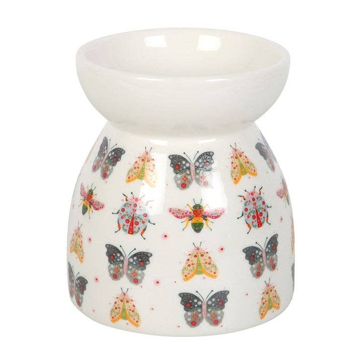 White ceramic oil burner with colorful insects design on a white background- Shadowplay Collection Gift Shop