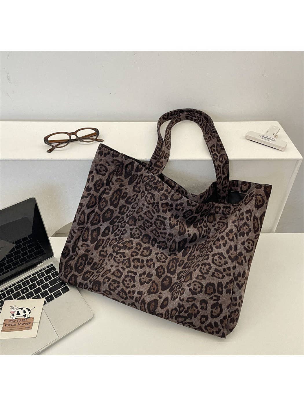 Leopard print tote bag on a desk with a laptop and glasses.-Shadowplay Collection Gift Shop