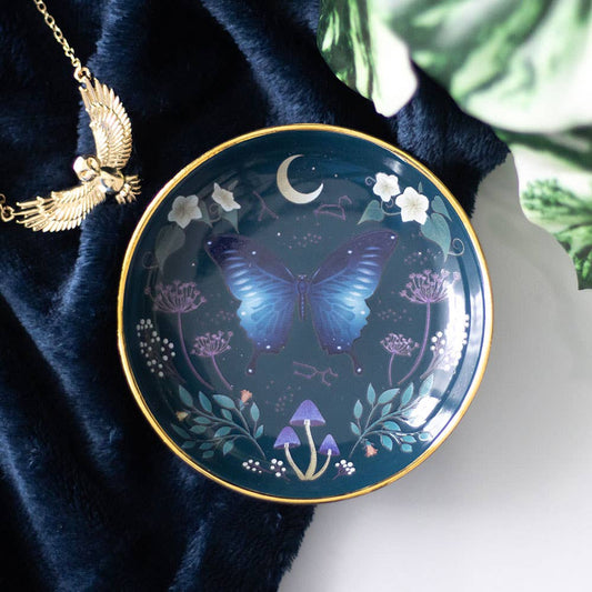 Decorative dish with moth design on a dark blue fabric background- Gothic Gifts