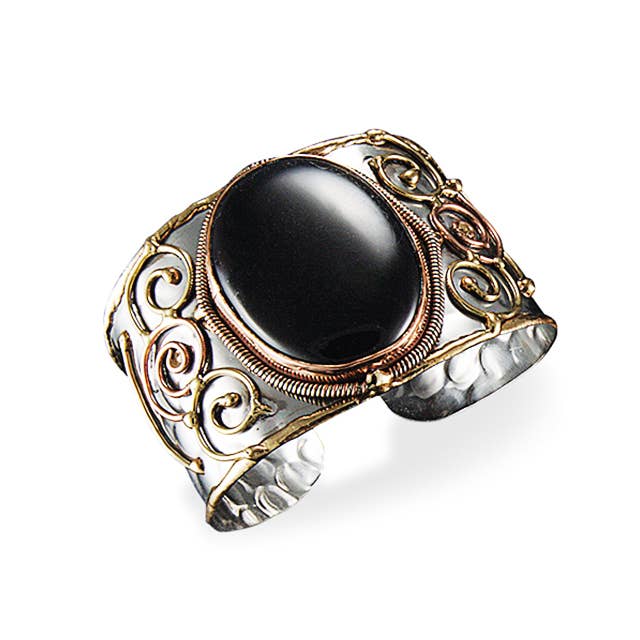 Decorative Cuff Bracelet with black stone and gold and silver detailing on a white background- Shadowplay Collection Gift Shop in San Antonio, TX