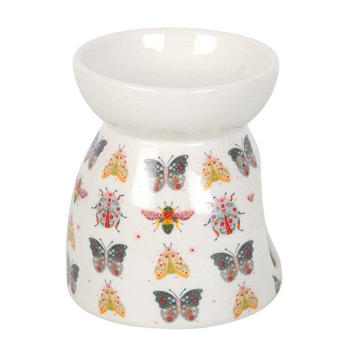 White ceramic oil burner with colorful bugs design on a white background- Shadowplay Collection Gift Shop