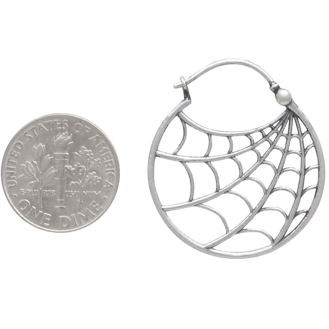 Sterling Silver Spiderweb Earring next to dime for scale on a white background- Shadowplay Collection Gift Shop