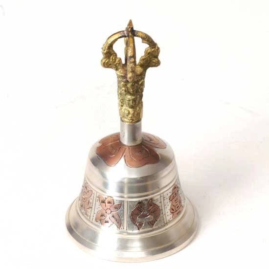 Decorative bell with a gold handle on a white background