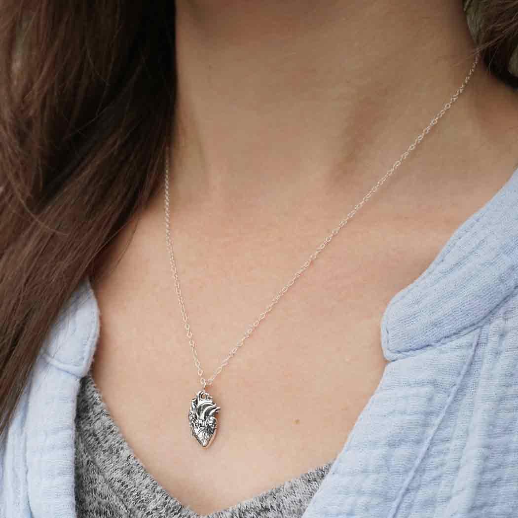 Woman wearing the Sterling Silver Anatomical Heart Necklace - Shadowplay Collection Gift Shop